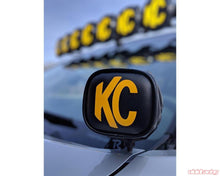Load image into Gallery viewer, 3in Soft Vinyl Cover - Round - Pair - Black / Yellow KC Logo (2)